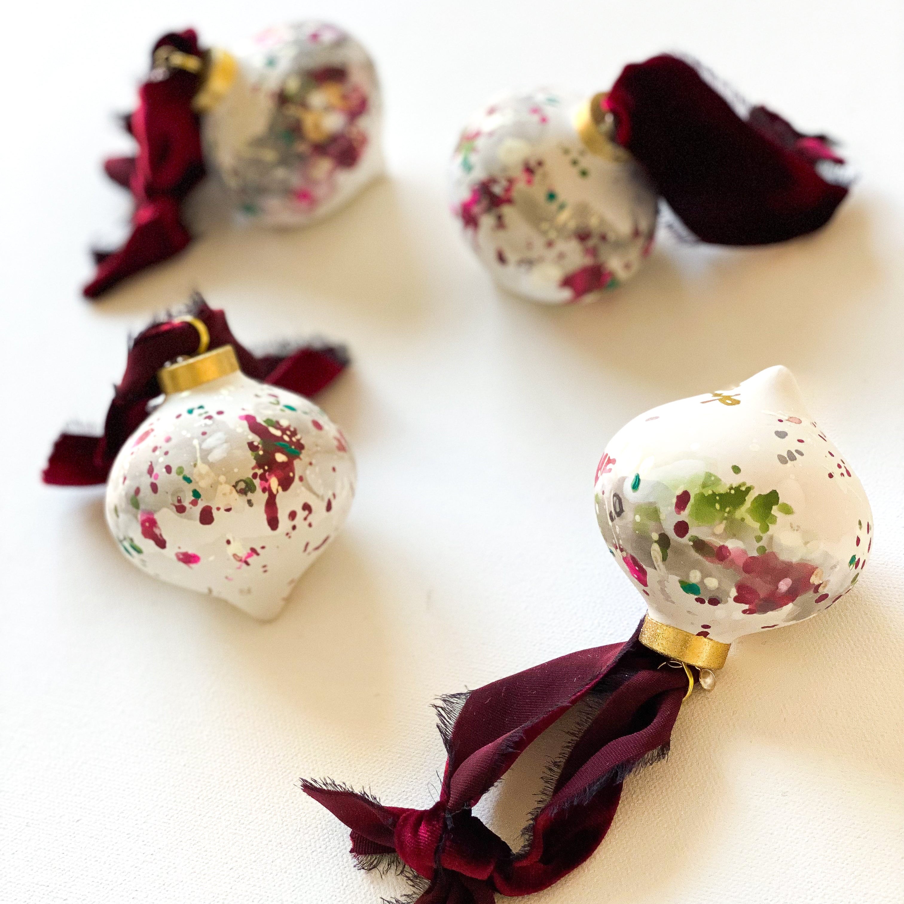 Decorative Christmas by dawn trimble art ornaments with ribbons on a white background