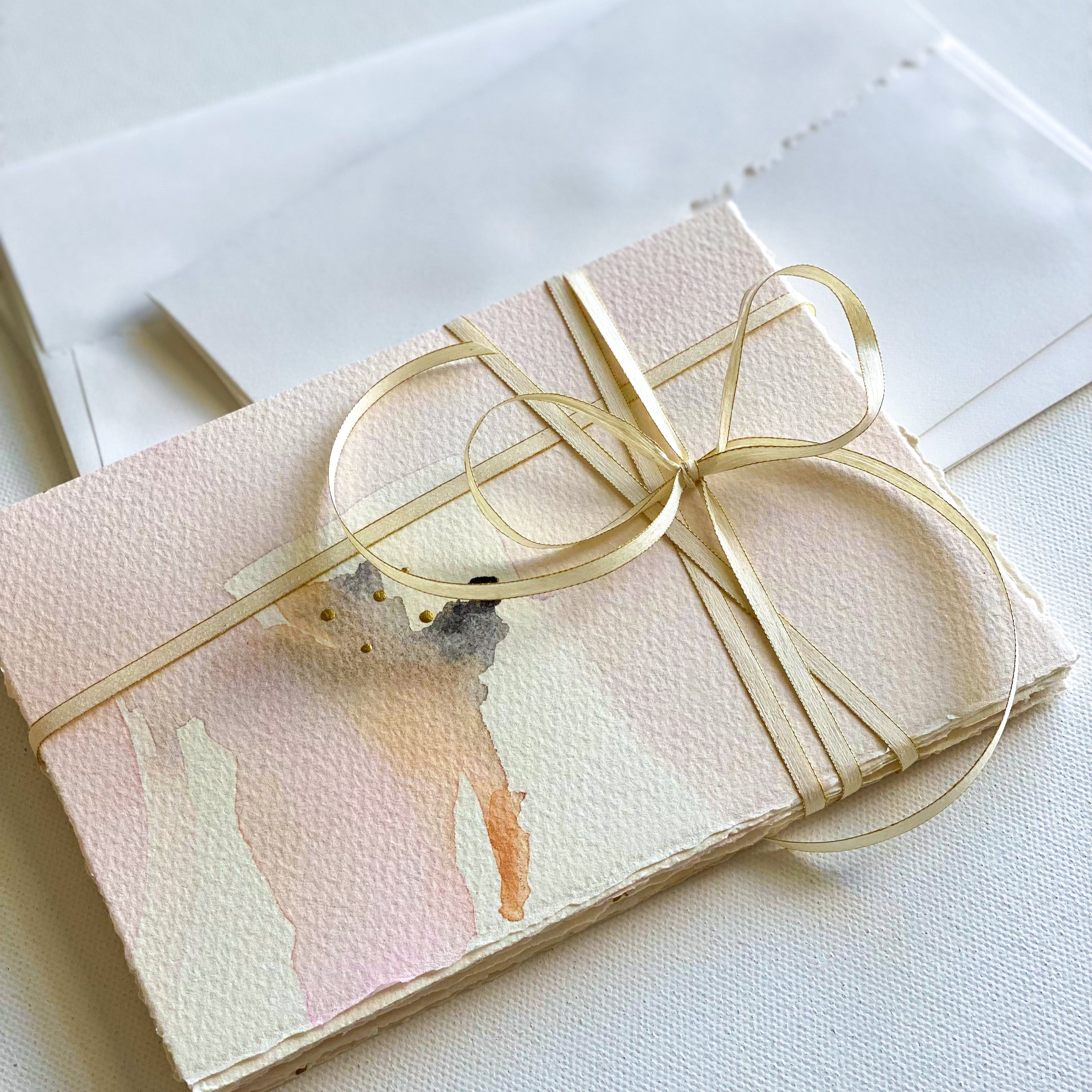 Gift-wrapped item with a bow on a light background