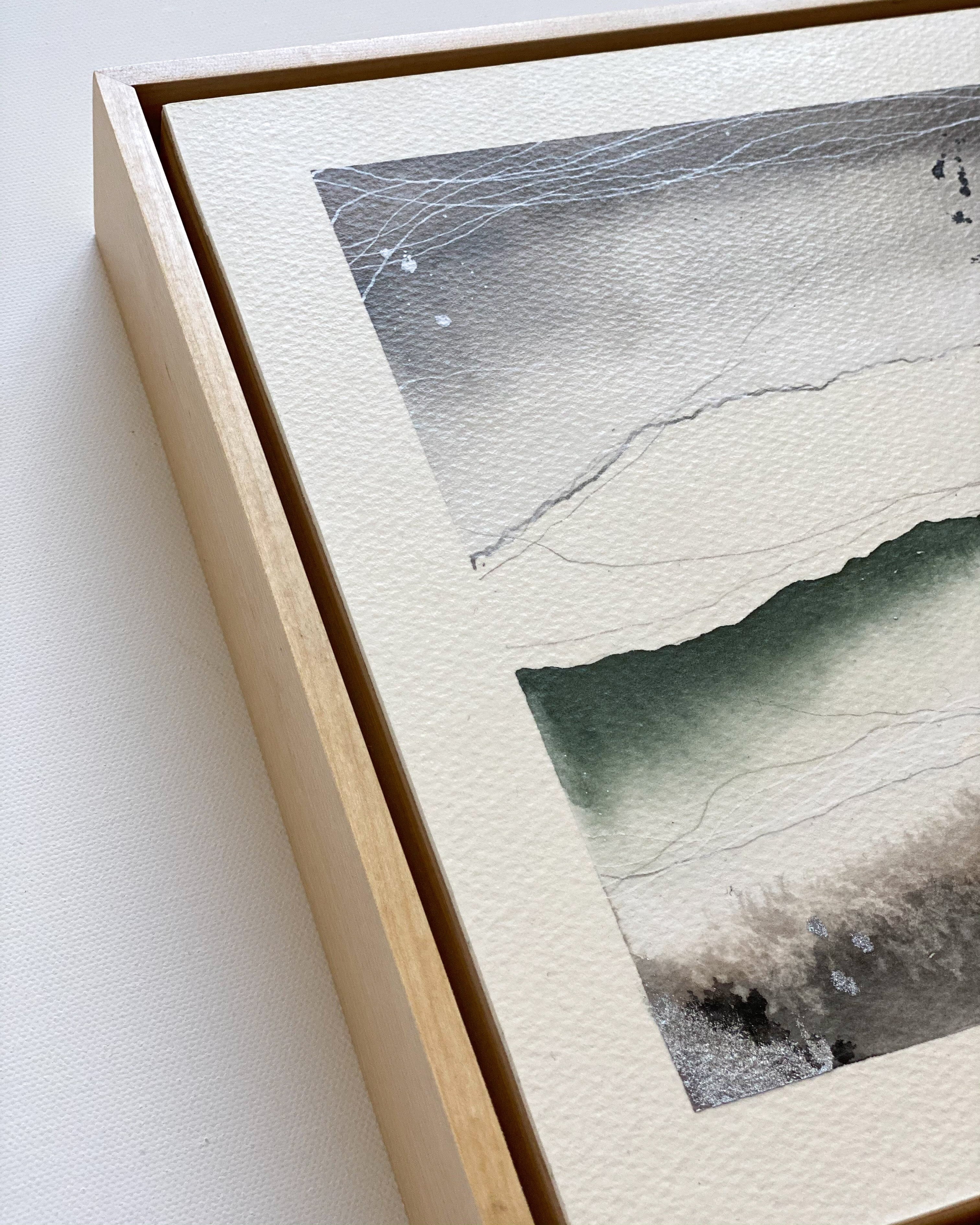 Framed artwork with a natural wood finish on a white background
