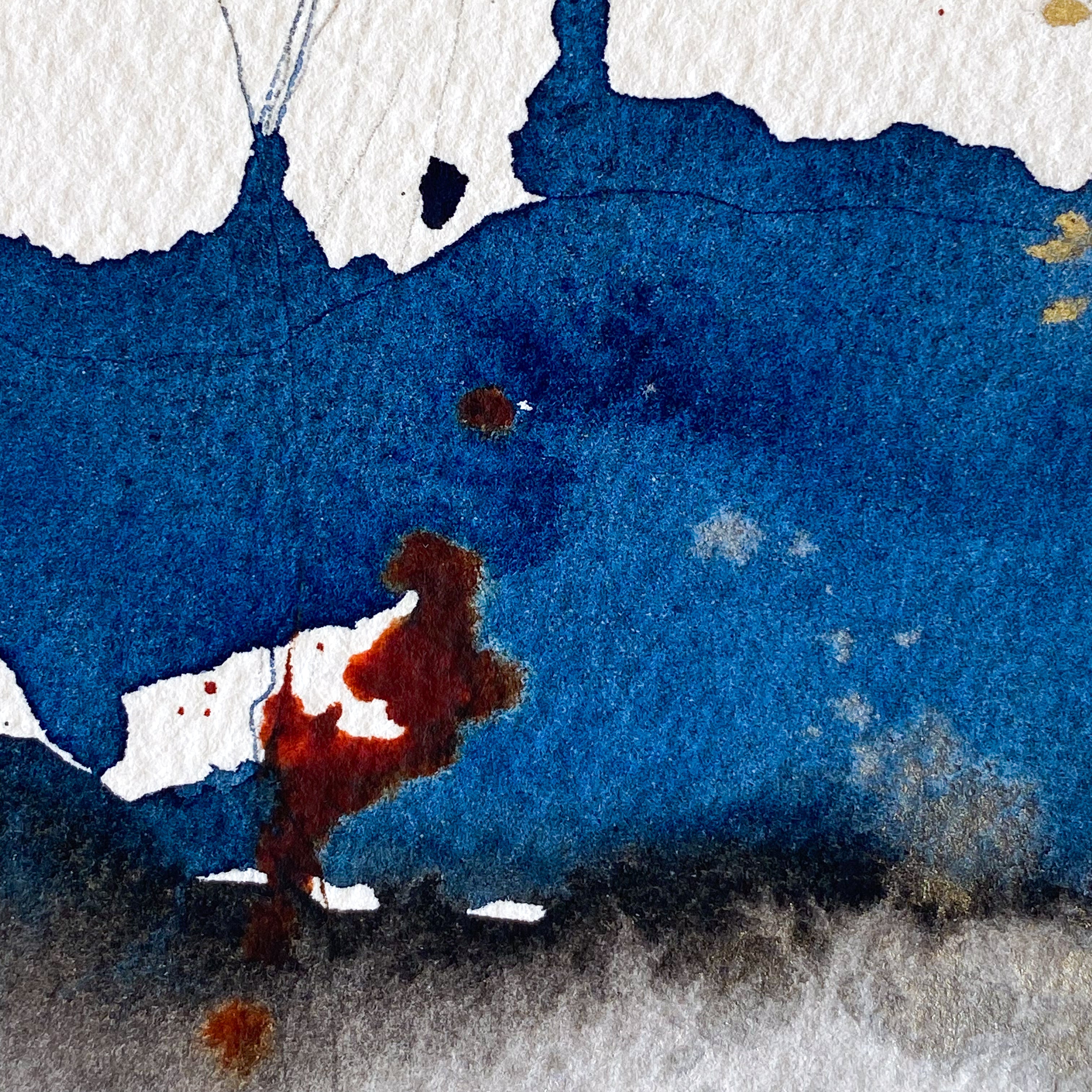 Abstract art with blue, red, and black splashes on a white background