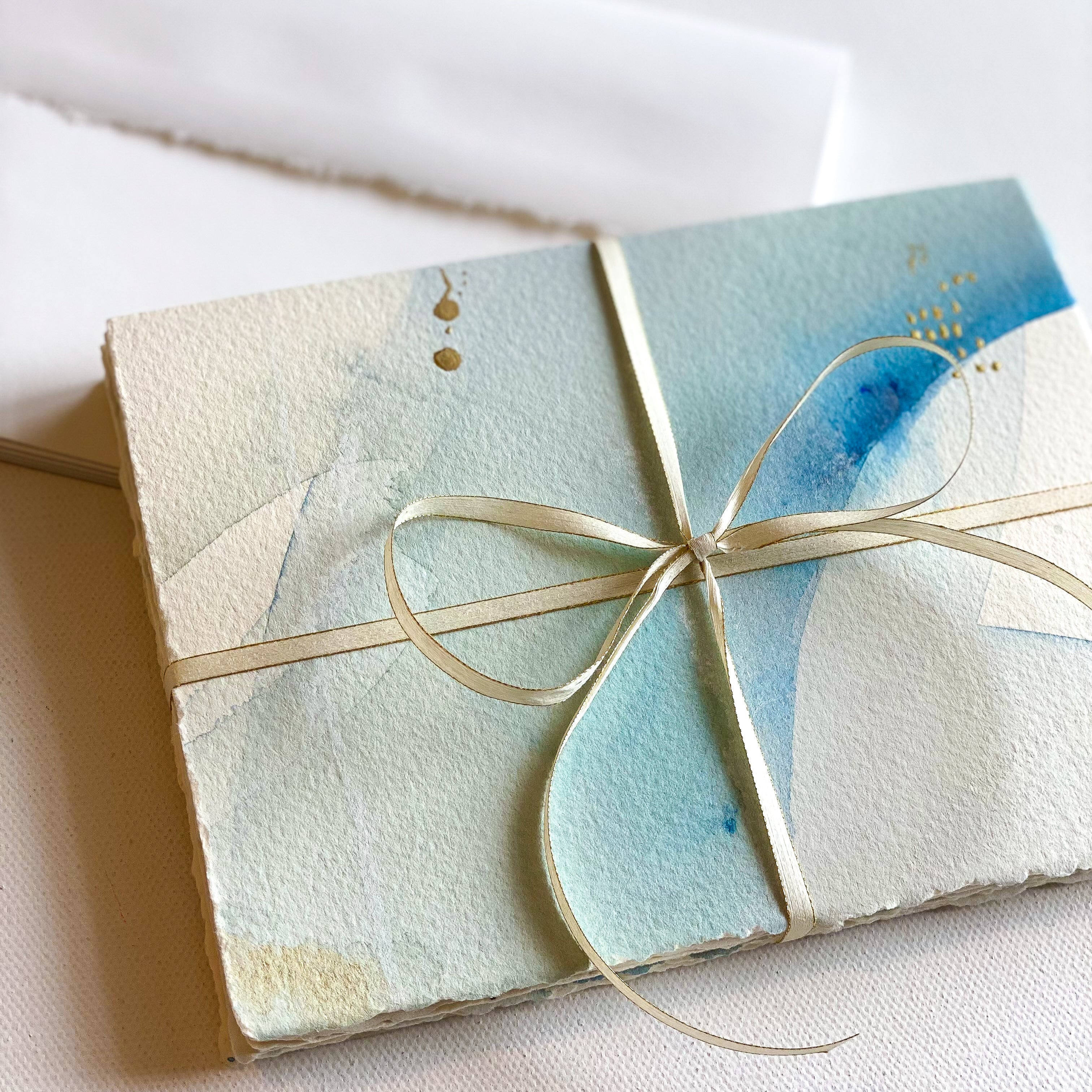 Gift box wrapped with a decorative ribbon on a white background